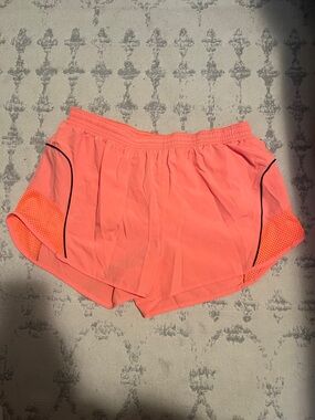 Neon coral Nike DriFit shorts
